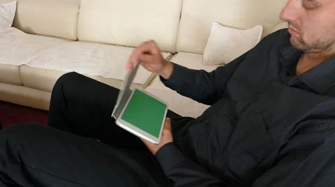 Male Model In Dark Jacket Looking At Ipad - Tablet Technology Internet Search Stock Footage 49217819