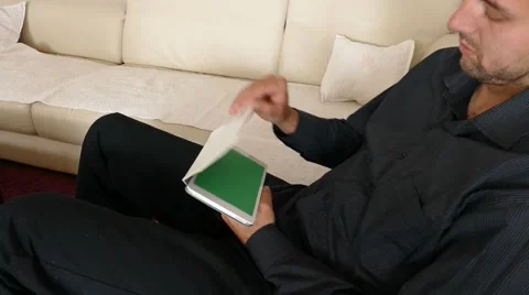 Male Model In Dark Jacket Looking At Ipad - Tablet Technology Internet Search Stock Footage 49241245