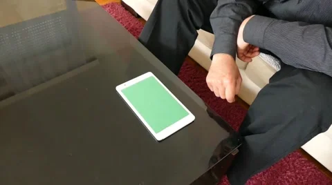 Male Model In Dark Jacket Looking At Ipad - Tablet Technology Internet Search Stock Footage 49241688