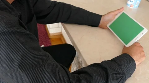 Male Model In Dark Jacket Looking At Ipad - Tablet Technology Internet Search Stock Footage 49242056