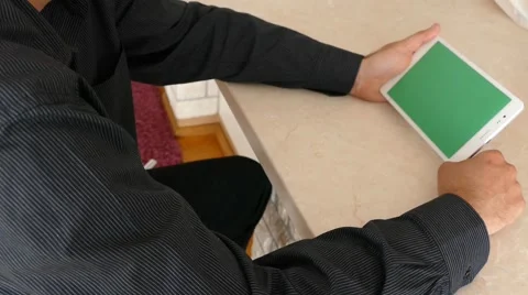 Male Model In Dark Jacket Looking At Ipad - Tablet Technology Internet Search Stock Footage 49243519