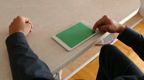 Male Model In Dark Jacket Looking At Ipad - Tablet Technology Internet Search Stock Footage 49283707