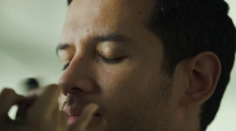 Male model getting makeup done by makeup artist Stock Footage 63305996