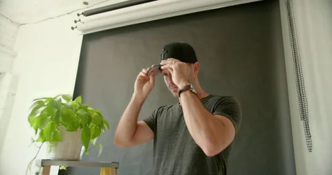 Male Model Putting On Hat Stock Footage 139375222