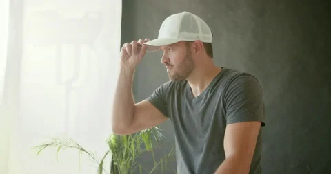 Male Model Putting On Hat Stock Footage 139375449