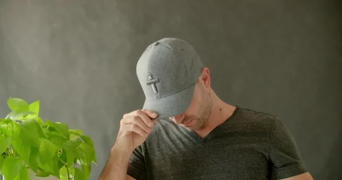 Male Model Putting On Hat Stock Footage 139375611