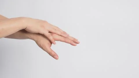 Male model is rub backs of both hands on white background. Stock Photos