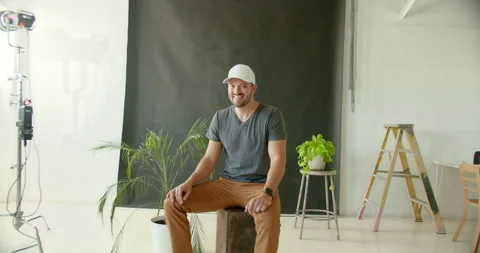 Male Model Smiling While Sitting Stock Footage 139375733