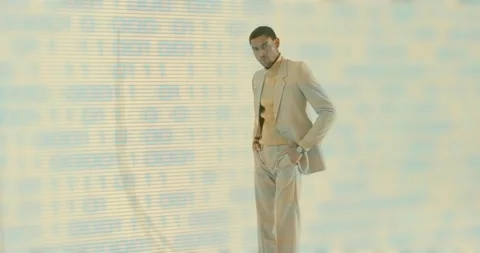 Male model stepping into frame with binary code backdrop pressing palm against Stock Footage 315489382