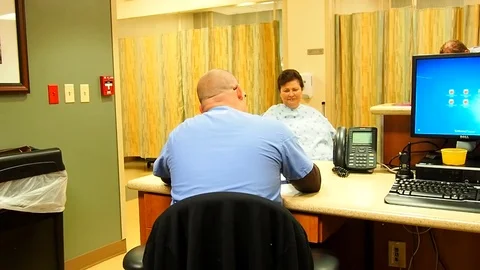 Male nurse at nurses station Stock Footage 70686830