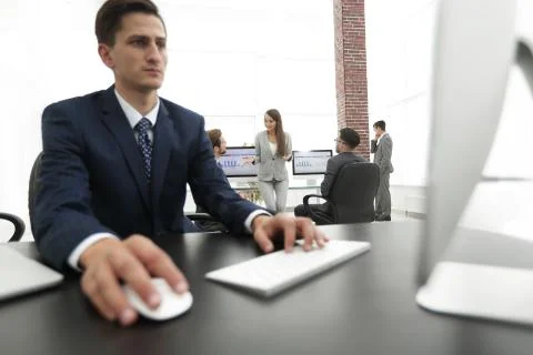 A male office worker browsing the computer for information Foto stock