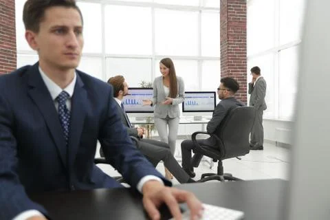 A male office worker browsing the computer for information Stock Photos