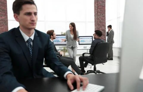A male office worker browsing the computer for information Stock Photos