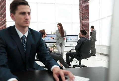 A male office worker browsing the computer for information Foto stock