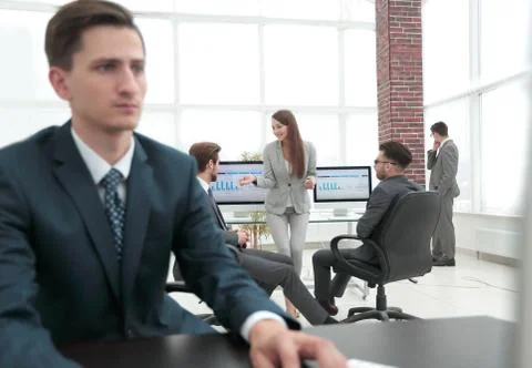 A male office worker browsing the computer for information Stock Photos