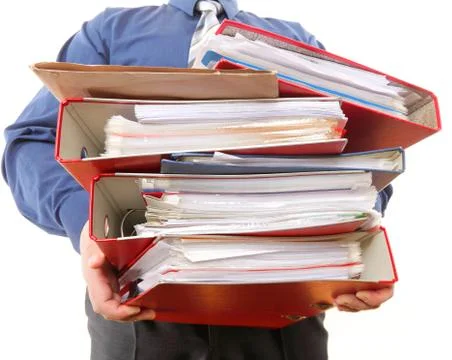Male office worker carrying a stack of files Stock Photos
