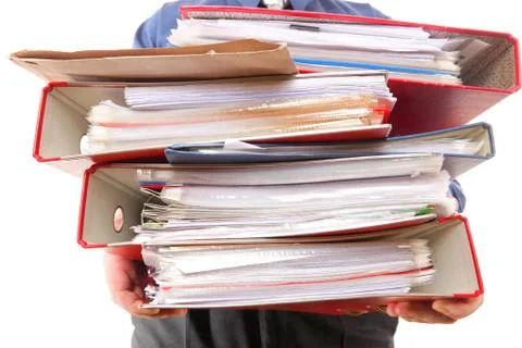 Male office worker carrying a stack of files Stock Photos