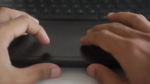Male office worker using touchpad while working on laptop Video stock 322205968