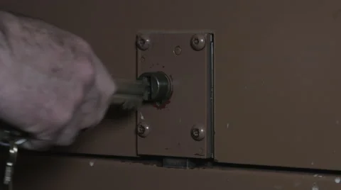 Male officer unlocking and opening door cu Stock Footage 44888564