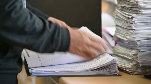 Male officials are managing documents at the office. Stock Footage 136529399