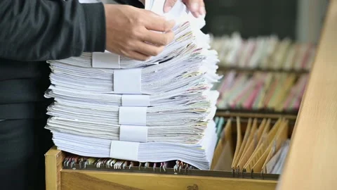 Male officials are managing documents at the office. 動画素材 136529519