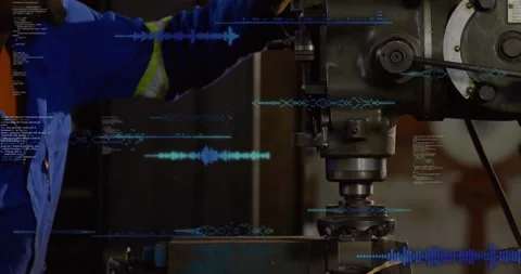 Male operator running milling machine in machine shop, displaying blue waveform Stock Footage 309145660