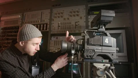 Male Operator Setting Up Camera for Broadcast in TV Production Truck Stock Footage 300398050