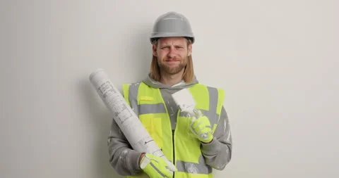 Male painter worker doesnt want to work shakes index finger and says no uses Stock Footage 155485317