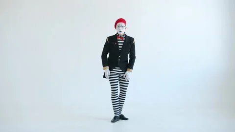 Male pantomimist looking at camera expressing fear then screaming on white Vídeo Stock 144388055