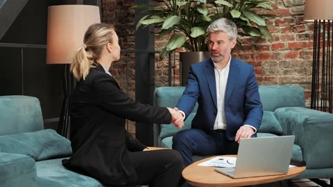 Male partner explaining contract details shaking hands successful deal goal. Video stock 232478367