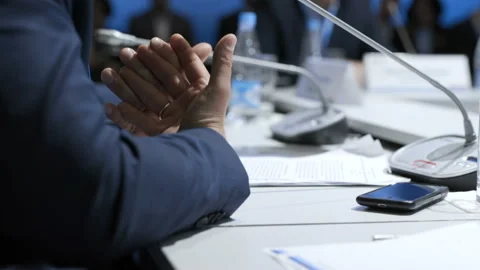 Male partner explaining development of team strategy at convention or congress. Stock Footage 199475280