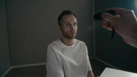 Male Patient Having Pupils Checked with Penlight in Clinic Stock Footage 336662976