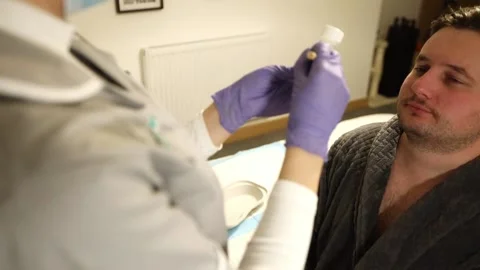 Close Up of Female Legs of a Woman in a Toilet Room Taking Off Her