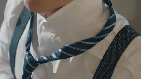 Male performer adjusting tie and practicing audition. Asian male performer Stock Footage 342061453
