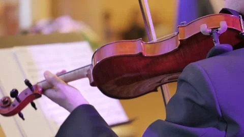 Male performs lead violin sole part playing at classical concert. Stock Footage 89932315