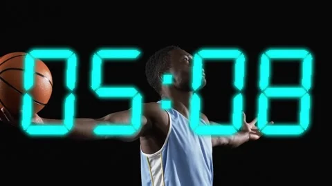 Male player holding ball posing when cyan timer starts, counting down, resetting Stock Footage 333396841