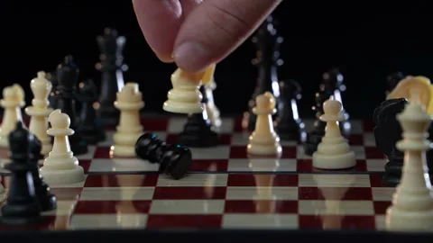 Male player makes a move, chess piece knight hits pawn. Intellectual strategy Video stock 169653026