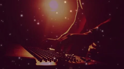 Male player reaching in, playing keys and tweaking knobs to shape music, stars 스톡 동영상 331214532