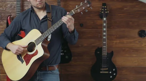 Male playing the acoustic guitar slow motion Stock Footage 59191041