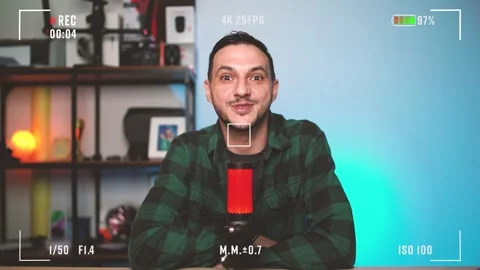Male Podcaster Talking into Microphone – Studio Recording Setup with Camera Video stock 319052961