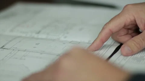 Male Pointing at Architecural Design Documents in an Office 库存影片 40648587