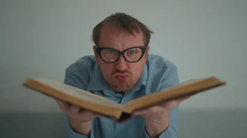 Male posing with book Stock Footage 240225532