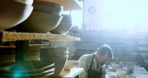 Male potter using digital tablet 4k Stock Footage 85319775