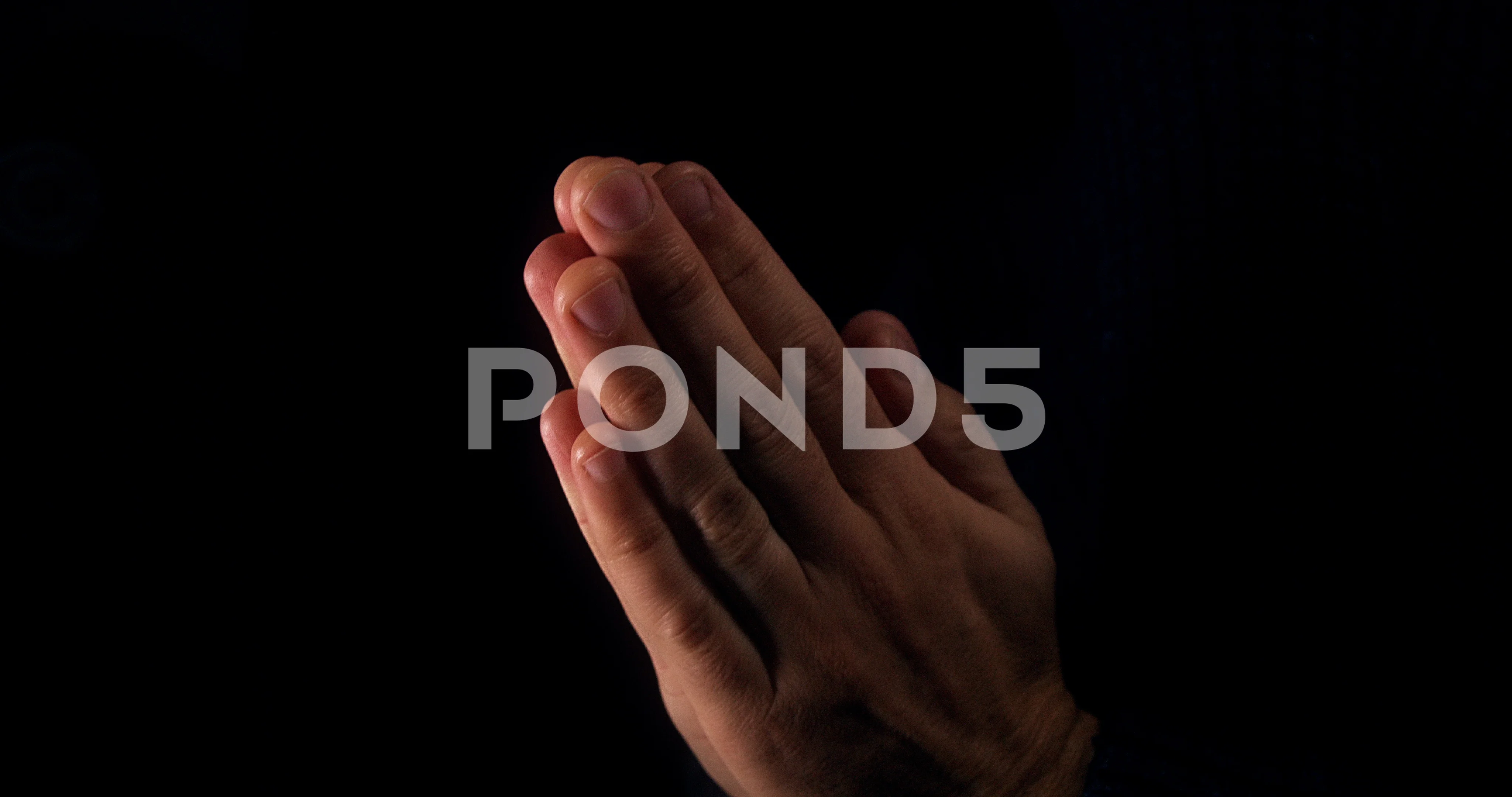 https://images.pond5.com/male-praying-hands-clasped-095650354_prevstill.jpeg