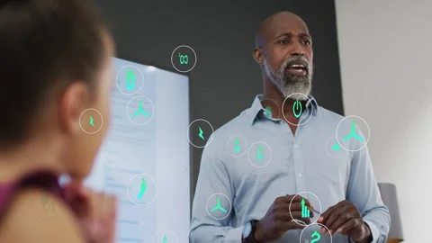 Male presenter gesturing during business meeting causing teal icons clustering Stock Footage 333552443
