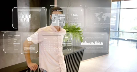 Male presenter leaning on table in reception, demonstrating tech data panels Stock Footage 318608060