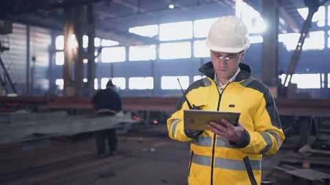 A male process engineer works on a personal computer. Portrait of a professional Stock Footage 240084797