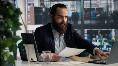Male professional analyzes performance data and KPIs metrics for decision making Stock Footage 327762027