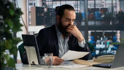 Male professional analyzes performance data and KPIs metrics for decision making Stock Photos