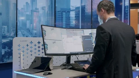 Male professional, facing computer screen, exploring software, World ATM Stock Footage 170779824